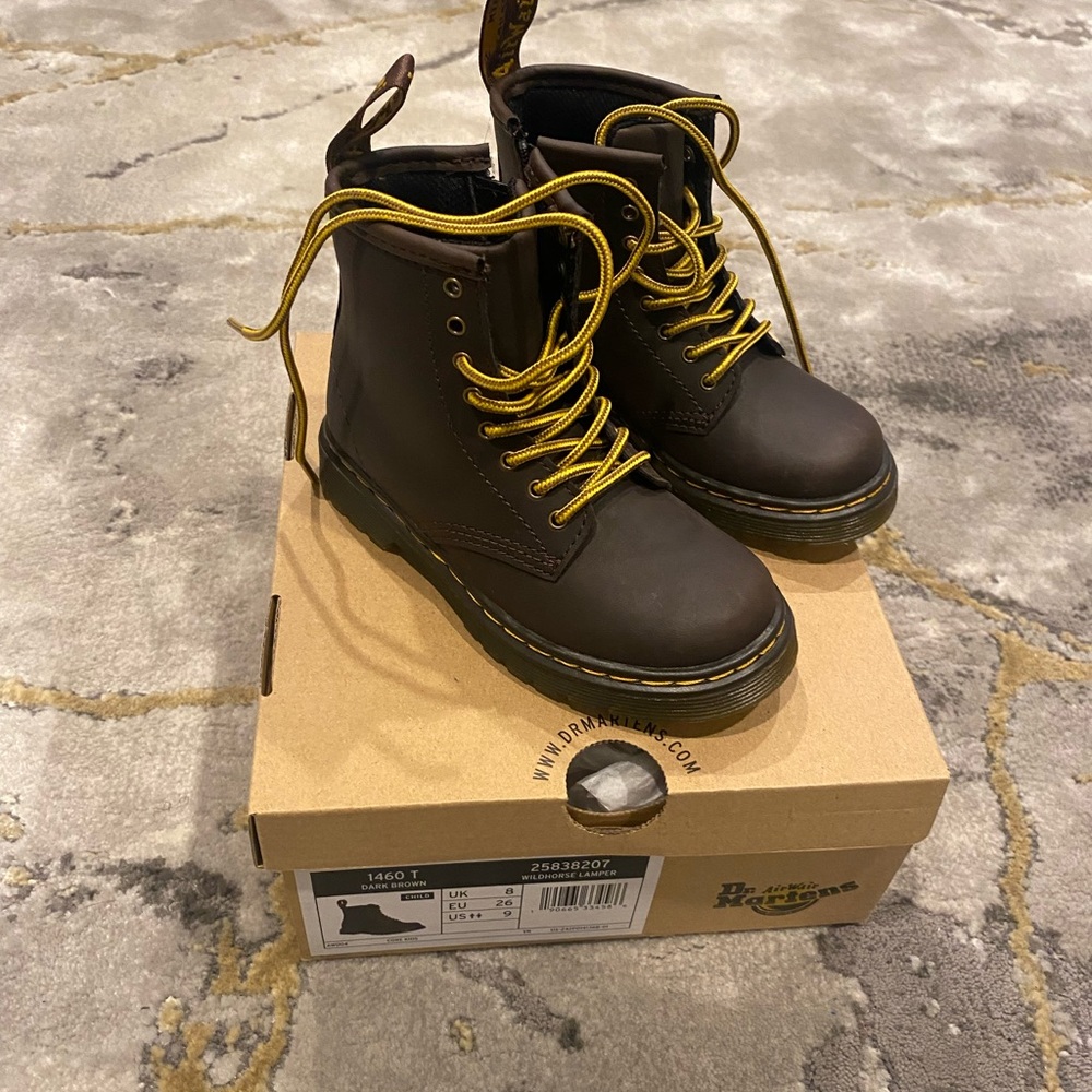 Brown Dr. Martens boots.